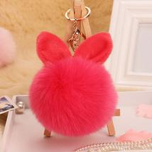 Pompom kulcstartóra, táskára akasztható nyuszi füles szőrme dísz hot pink